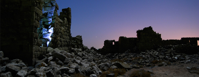 Main image: Moonlight shines on rubble under a winter night sky in the remote northern section of Umm el-Jimal's ancient Byzantine and early Islamic town.
